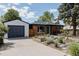 Charming brick home featuring a well-manicured front yard and detached garage at 1695 S Beach Ct, Denver, CO 80219