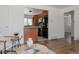 View of the open-concept living area flowing seamlessly into an updated kitchen at 1695 S Beach Ct, Denver, CO 80219