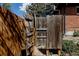 Outdoor shower area with wood privacy fence, offering a refreshing open-air experience at 1695 S Beach Ct, Denver, CO 80219