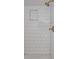 Contemporary bathroom with white subway tile shower and brass hardware at 1695 S Beach Ct, Denver, CO 80219