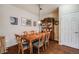 A dining room features a dining table, hardwood floors, and neutral colored walls at 15700 E Jamison Dr # 6-101, Englewood, CO 80112