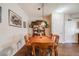 A dining room features a wooden dining table and chair set with a china cabinet in the corner at 15700 E Jamison Dr # 6-101, Englewood, CO 80112