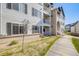 A beautiful condo building featuring multiple balconies and an inviting walkway at 15700 E Jamison Dr # 6-101, Englewood, CO 80112