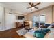A well-lit living room offers a comfortable couch and access to an outdoor patio at 15700 E Jamison Dr # 6-101, Englewood, CO 80112