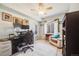 Home office space with ergonomic chair, built-in shelving, and lots of natural light at 15700 E Jamison Dr # 6-101, Englewood, CO 80112