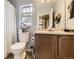 Bathroom featuring a toilet, vanity, and a shower with a curtain at 2115 Coach House Loop, Castle Rock, CO 80109