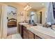 Bathroom featuring double sinks, modern fixtures, and a spacious layout at 2115 Coach House Loop, Castle Rock, CO 80109