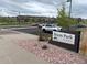 View of Bison Park sign with parking and playground featuring park amenities in a residential community at 2115 Coach House Loop, Castle Rock, CO 80109
