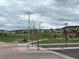 View of community park area with playground, picnic area and parkway for neighborhood at 2115 Coach House Loop, Castle Rock, CO 80109
