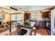 Open-concept kitchen with dark wood cabinets, stainless appliances, and a center island with seating at 2115 Coach House Loop, Castle Rock, CO 80109