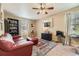 Office with a red leather couch, bookcase, and a window with natural light at 2115 Coach House Loop, Castle Rock, CO 80109