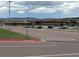 Exterior shot of school building and expansive parking lot at 2115 Coach House Loop, Castle Rock, CO 80109