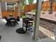 Covered patio featuring an outdoor grill and a dining table set for casual entertaining and backyard relaxation at 2115 Coach House Loop, Castle Rock, CO 80109