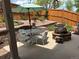 Outdoor patio area with a table, chairs, and a fire pit, perfect for relaxing evenings and outdoor enjoyment at 2115 Coach House Loop, Castle Rock, CO 80109