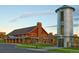 Community recreation center with a modern building and unique silo, surrounded by manicured lawns at 2115 Coach House Loop, Castle Rock, CO 80109