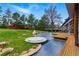 Large backyard with lawn, hot tub, solar panels, and patio area, perfect for outdoor living and relaxation at 182 Ridge Rd, Boulder, CO 80303