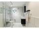 Modern bathroom with glass-enclosed shower, sleek vanity, contemporary fixtures, and tiled walls at 182 Ridge Rd, Boulder, CO 80303