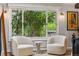 Cozy bedroom seating area with lush views of backyard at 182 Ridge Rd, Boulder, CO 80303