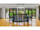 Dining area with a large table and chairs overlooking the expansive yard at 182 Ridge Rd, Boulder, CO 80303