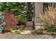 Exterior view of home surrounded by lush landscaping, shrubbery and flowers at 182 Ridge Rd, Boulder, CO 80303