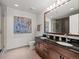 Modern bathroom with double vanity, granite counters, and updated fixtures with a shower at 891 14Th St # 3510, Denver, CO 80202