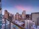 Stunning city views from the balcony of this high-rise condo, with evening sky at 891 14Th St # 3510, Denver, CO 80202