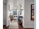 Elegant condo hallway with hardwood floors leading to a bright, open living space at 891 14Th St # 3510, Denver, CO 80202