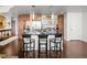 Kitchen island with bar seating, sleek countertops, and modern pendant lighting at 891 14Th St # 3510, Denver, CO 80202