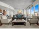 Bright, modern living room with floor-to-ceiling windows and sophisticated decor and city view at 891 14Th St # 3510, Denver, CO 80202