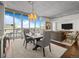 Elegant dining area with city views, flowing into a comfortable living space at 891 14Th St # 3510, Denver, CO 80202