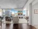 Contemporary living area with floor-to-ceiling windows offering panoramic city views and hardwood floors at 891 14Th St # 3510, Denver, CO 80202