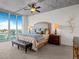 Serene main bedroom featuring cityscape views, a ceiling fan, and natural lighting at 891 14Th St # 3510, Denver, CO 80202