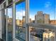 Stunning city view framed by large windows, showcasing the vibrant urban landscape at 891 14Th St # 3510, Denver, CO 80202