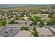 Expansive aerial shot of a community with varied rooftops and verdant trees, presenting a harmonious blend of nature and housing at 6948 Buckskin Dr, Littleton, CO 80125