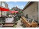 Charming backyard with a stone pathway, lush landscaping, and serene water feature at 6948 Buckskin Dr, Littleton, CO 80125