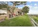 Sprawling backyard featuring a lush lawn, patio, and scenic views from the edge of the property at 6948 Buckskin Dr, Littleton, CO 80125