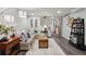 Finished basement with comfortable seating, stylish decor, and a sliding barn door at 6948 Buckskin Dr, Littleton, CO 80125