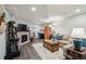Finished basement with brick fireplace, entertainment area, and comfortable seating for relaxation at 6948 Buckskin Dr, Littleton, CO 80125