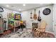 Finished basement with pinball machines, guitars, and dart board for a fun recreational space at 6948 Buckskin Dr, Littleton, CO 80125