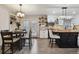 Bright and open kitchen with a dining area, featuring modern appliances and ample counter space at 6948 Buckskin Dr, Littleton, CO 80125