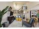 Bright and open living room with modern furnishings, a staircase, and stylish decor at 6948 Buckskin Dr, Littleton, CO 80125