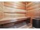 A wooden sauna with bench seating and an electric heater for a relaxing home spa experience at 6948 Buckskin Dr, Littleton, CO 80125