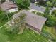 Aerial view of a well maintained single Gathering home with a large yard and mature trees at 8481 E Briarwood Blvd, Centennial, CO 80112