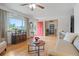 Inviting living room boasting hardwood floors, a bright window, and seamless flow to other rooms at 8481 E Briarwood Blvd, Centennial, CO 80112