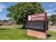 Close proximity to Walnut Hills Elementary with electronic sign board and green lawn in front at 8481 E Briarwood Blvd, Centennial, CO 80112