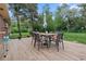 Inviting outdoor patio with dining set, umbrella, and lush greenery, perfect for entertaining guests at 8481 E Briarwood Blvd, Centennial, CO 80112