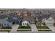 Aerial view of a residential neighborhood featuring well-maintained homes and manicured lawns at 4422 Mt Shavano St, Brighton, CO 80601
