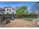Landscaped backyard with a cozy seating area, stone features, and ample space for outdoor activities at 4422 Mt Shavano St, Brighton, CO 80601