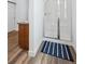 Clean bathroom with a glass shower, vanity, and wood-look flooring at 4422 Mt Shavano St, Brighton, CO 80601