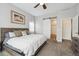 Bedroom featuring a large bed, ceiling fan, and closet access at 4422 Mt Shavano St, Brighton, CO 80601